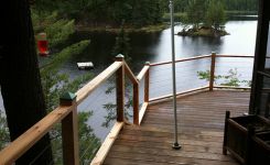 Deck railing added at cabin